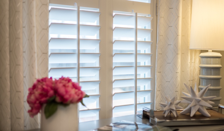 Plantation shutters by flowers in Orlando